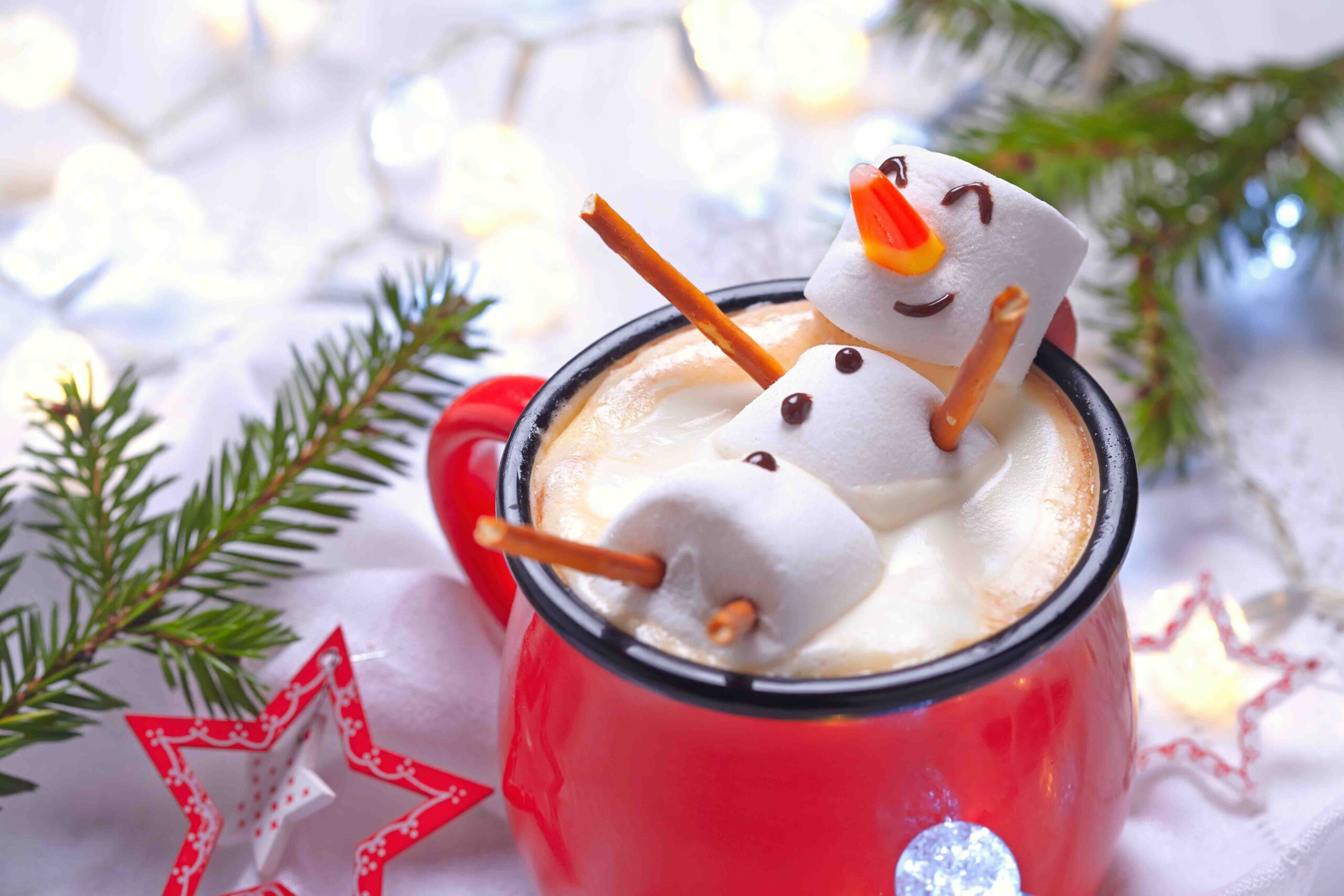 Red mug with hot chocolate with melted marshmallow snowman - Image