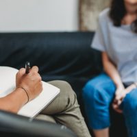 Psychotherapy session, woman talking to his psychologist in the studio