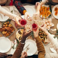 Celebration Toast over Festive Dinner Table